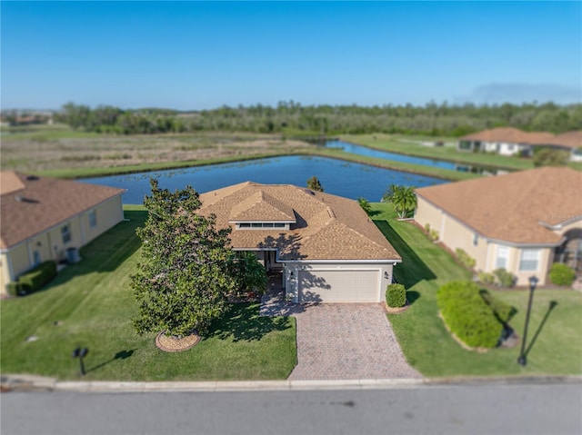 birds eye view of property featuring a water view