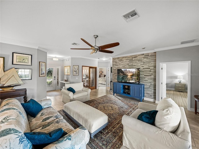 living area featuring crown molding, visible vents, and ceiling fan