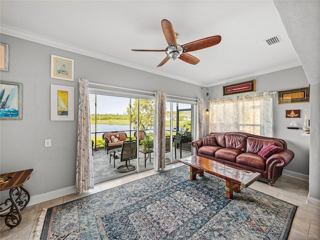 living area featuring baseboards, a ceiling fan, visible vents, and ornamental molding