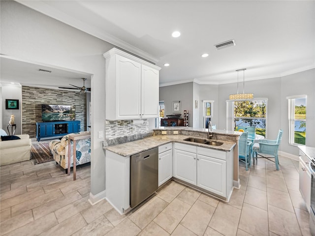 kitchen with visible vents, ornamental molding, a sink, a peninsula, and dishwasher