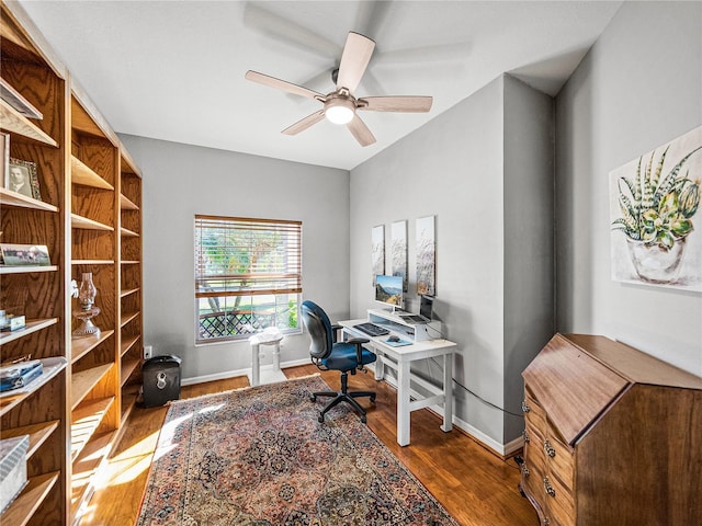 home office with baseboards, wood finished floors, and a ceiling fan