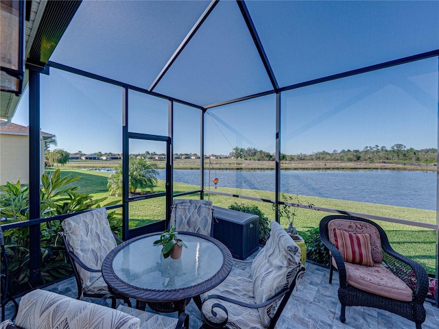 unfurnished sunroom with a water view