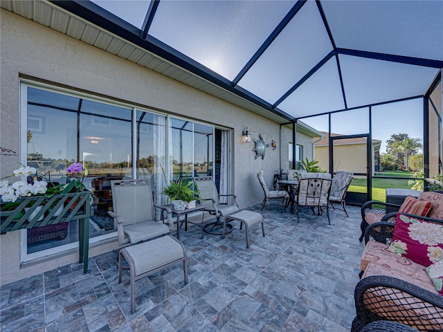 view of patio / terrace with a lanai and outdoor dining area