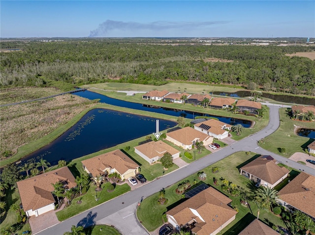 bird's eye view with a residential view, a water view, and a view of trees