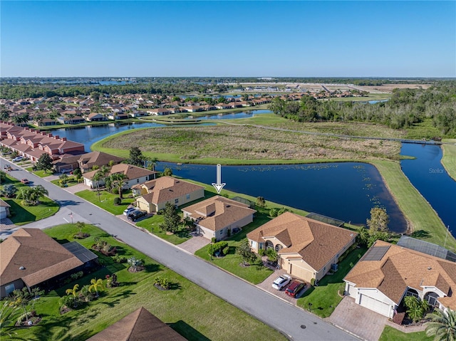 bird's eye view with a residential view and a water view