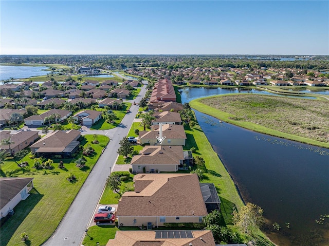 birds eye view of property with a residential view and a water view