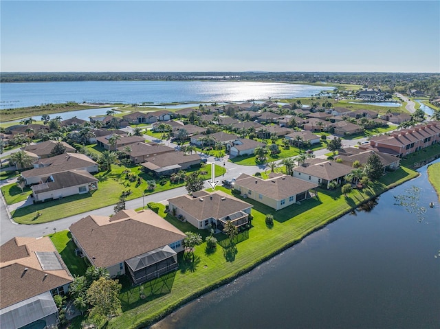 bird's eye view with a residential view and a water view