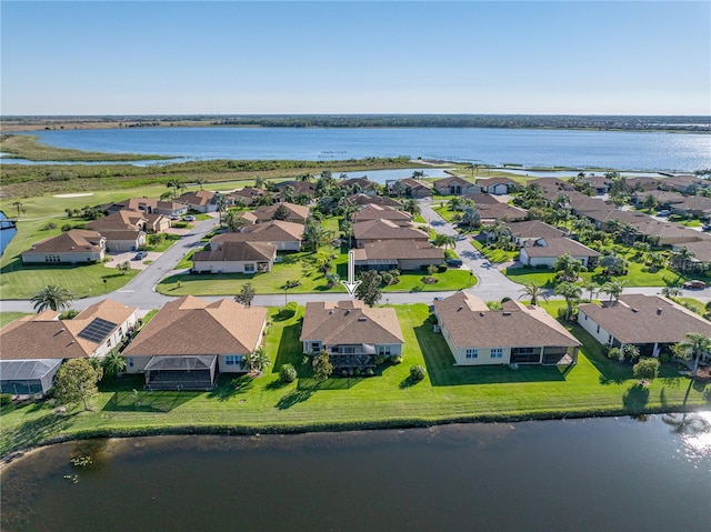 aerial view featuring a residential view and a water view