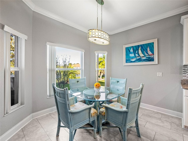 dining room with light tile patterned floors, baseboards, and ornamental molding