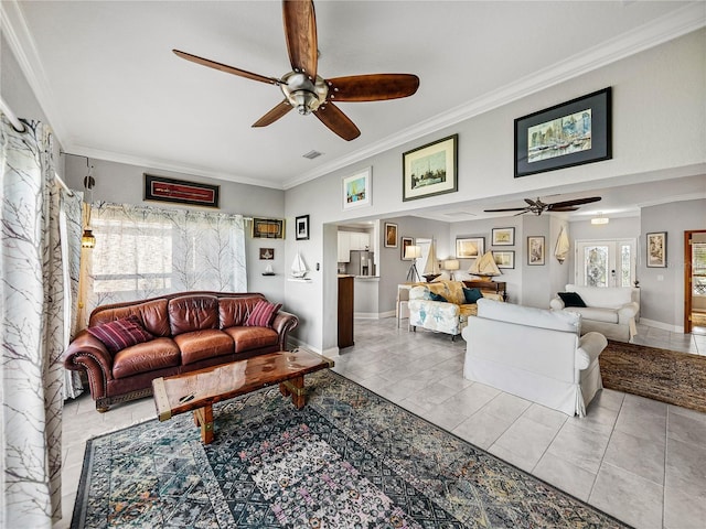 living room featuring tile patterned flooring, crown molding, and a ceiling fan