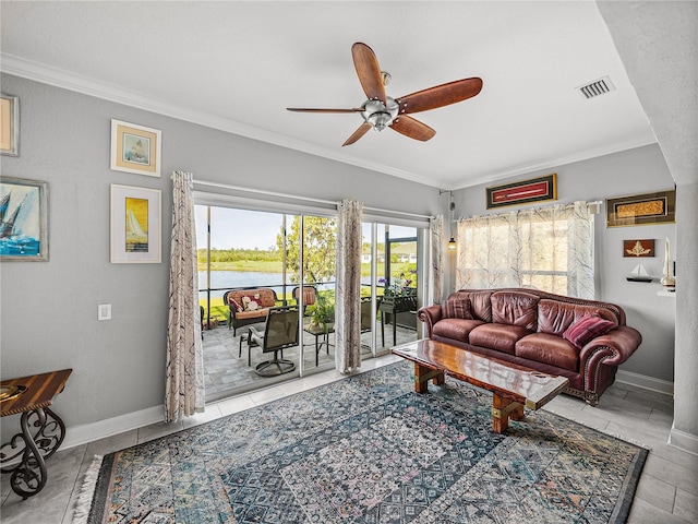 living room with baseboards, visible vents, ornamental molding, ceiling fan, and a water view
