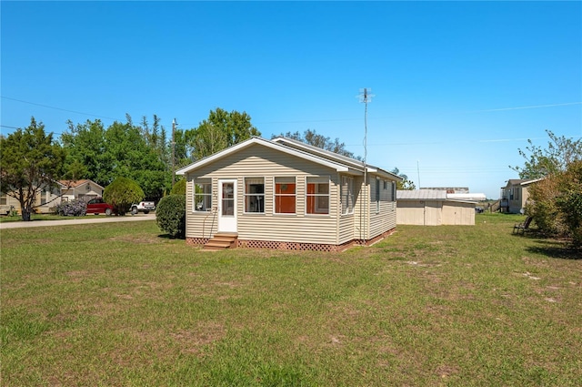 exterior space with a front lawn and entry steps