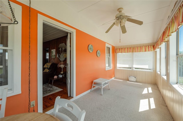 sunroom / solarium featuring ceiling fan