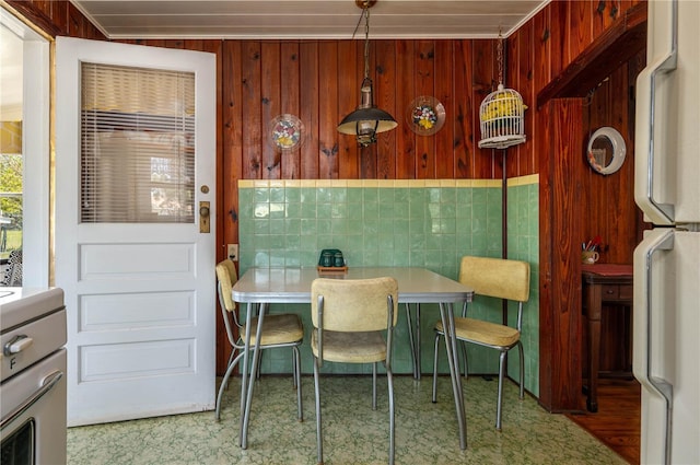 dining area with breakfast area and wooden walls