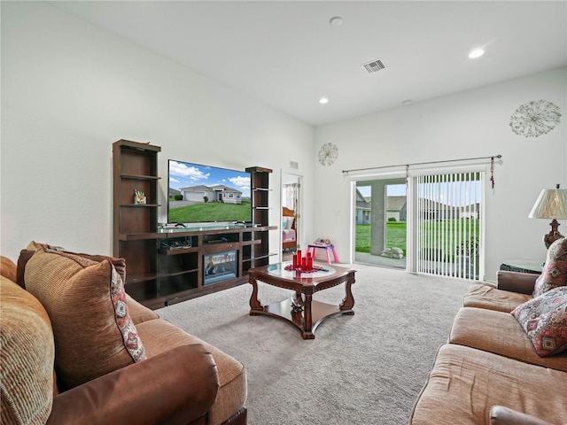 carpeted living area featuring recessed lighting and visible vents