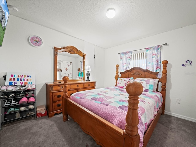 bedroom with a textured ceiling and carpet