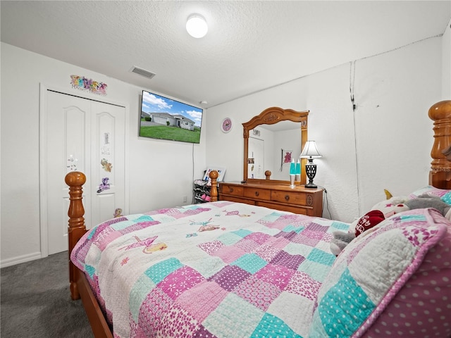 carpeted bedroom featuring visible vents and a textured ceiling