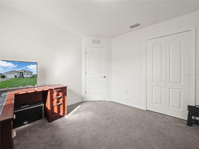 home office featuring baseboards, visible vents, and carpet floors