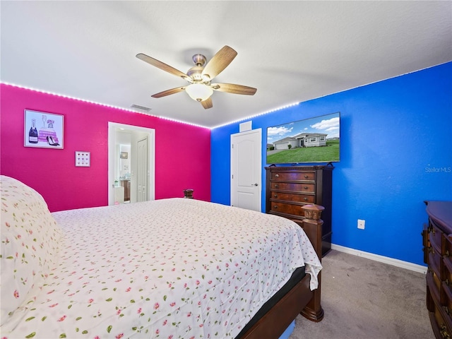 carpeted bedroom with visible vents, baseboards, a closet, and ceiling fan