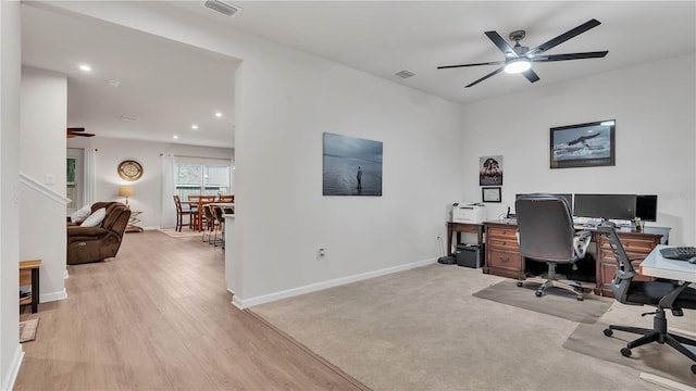 office area with visible vents, baseboards, and a ceiling fan