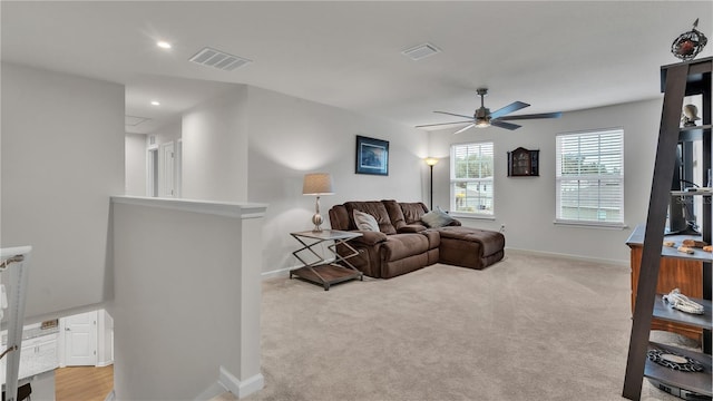 living area featuring visible vents, recessed lighting, baseboards, light colored carpet, and ceiling fan