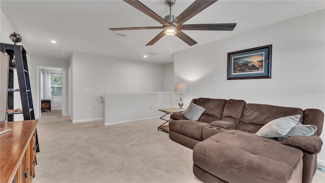 living area featuring a ceiling fan, visible vents, baseboards, recessed lighting, and light carpet