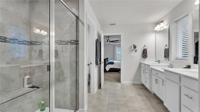 full bath with double vanity, visible vents, and a shower stall