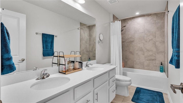 full bathroom featuring tile patterned floors, shower / tub combo, visible vents, and a sink