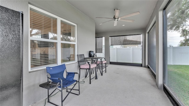 sunroom with a ceiling fan