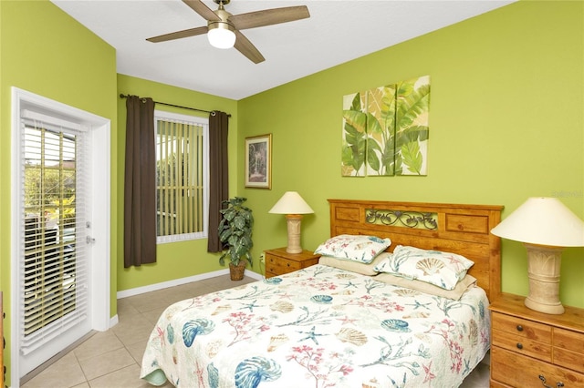 tiled bedroom with a ceiling fan and baseboards