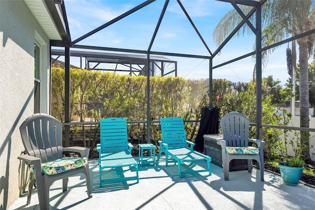 view of patio / terrace with a lanai