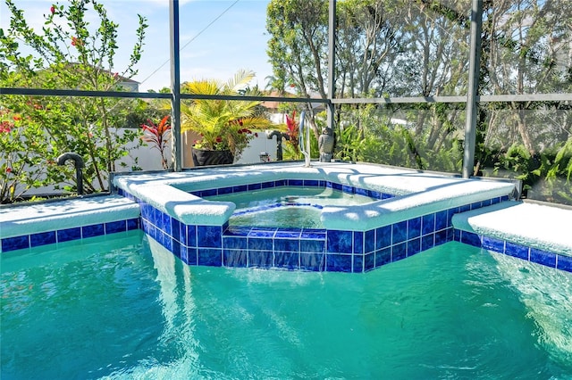 view of swimming pool with a lanai and a pool with connected hot tub