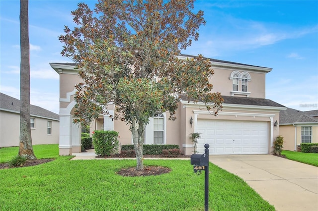 view of front of house with a garage, stucco siding, driveway, and a front yard