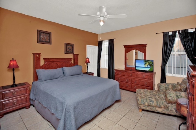 bedroom with light tile patterned flooring and a ceiling fan