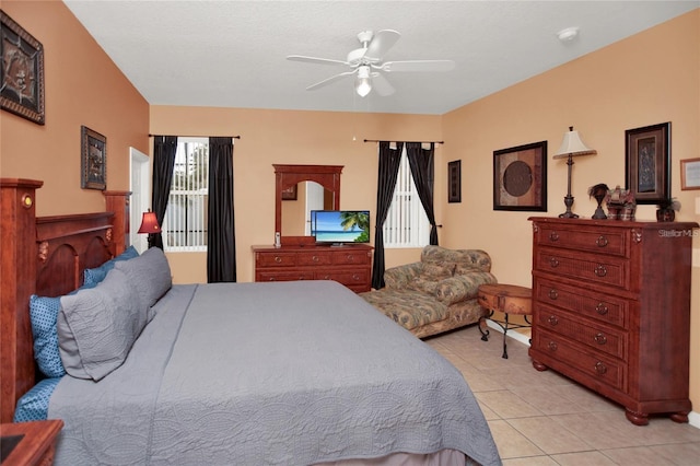 bedroom featuring ceiling fan and light tile patterned flooring