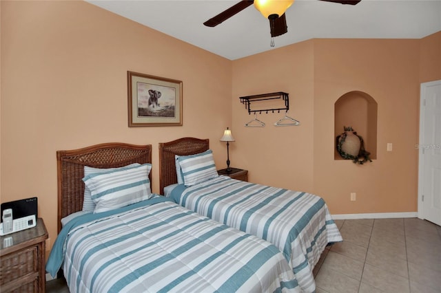 bedroom featuring tile patterned flooring, a ceiling fan, and baseboards