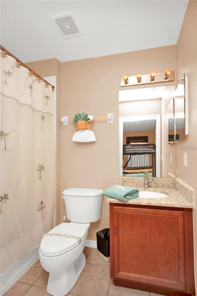 bathroom with visible vents, toilet, curtained shower, tile patterned flooring, and vanity