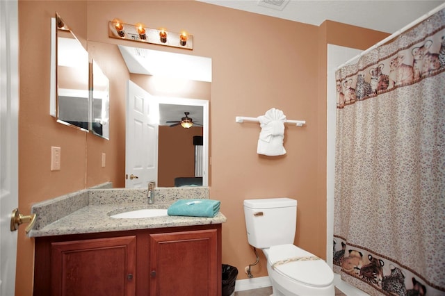 bathroom featuring visible vents, toilet, a shower with shower curtain, ceiling fan, and vanity