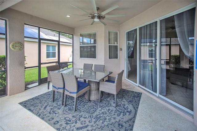 sunroom with ceiling fan