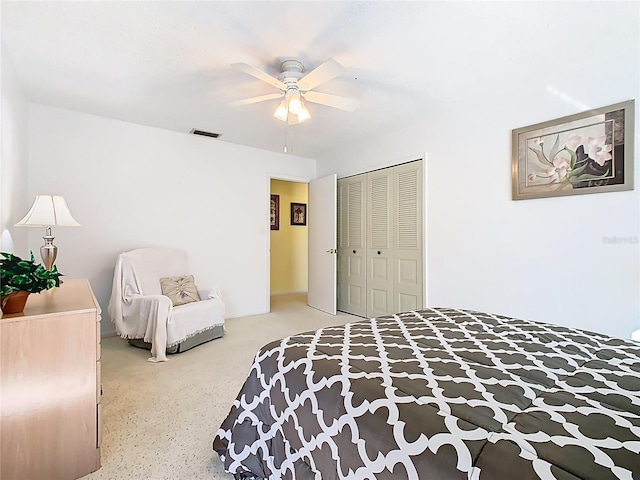 bedroom with visible vents, a closet, and a ceiling fan