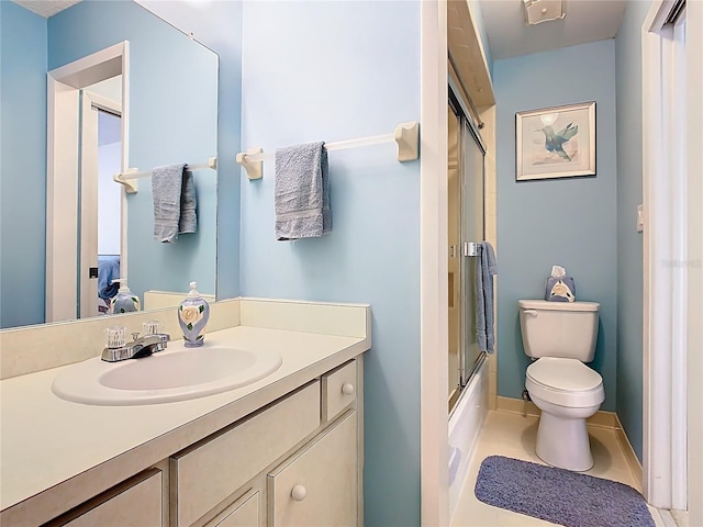 full bathroom with vanity, toilet, tile patterned flooring, and shower / bath combination with glass door