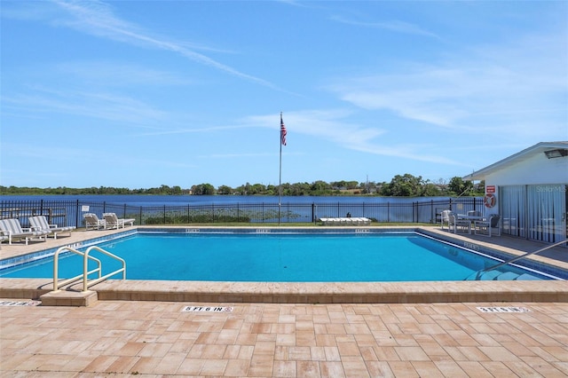 pool featuring a patio area and fence