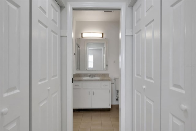 bathroom featuring vanity and tile patterned flooring