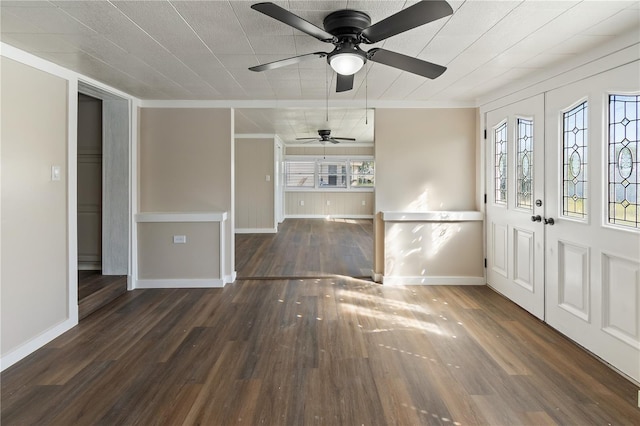 entrance foyer featuring baseboards, wood finished floors, and a ceiling fan