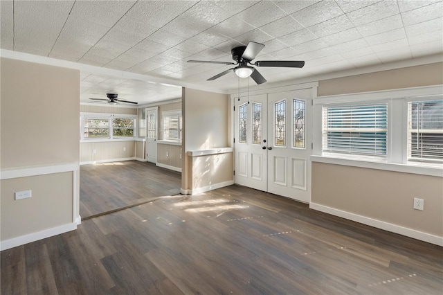 entrance foyer featuring wood finished floors, a ceiling fan, and baseboards