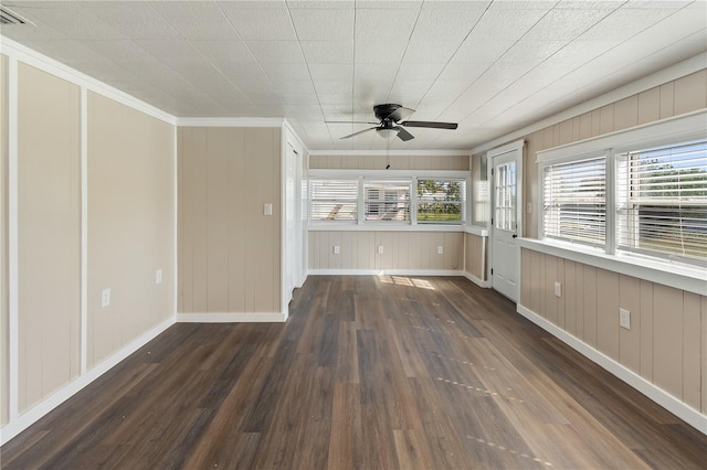 unfurnished living room featuring a healthy amount of sunlight, a ceiling fan, and wood finished floors