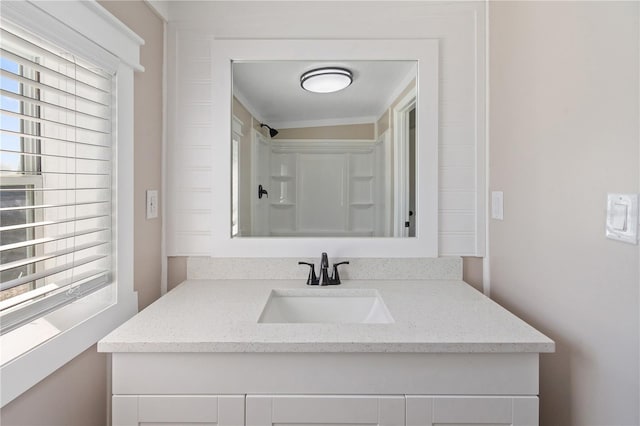 bathroom featuring vanity and a shower