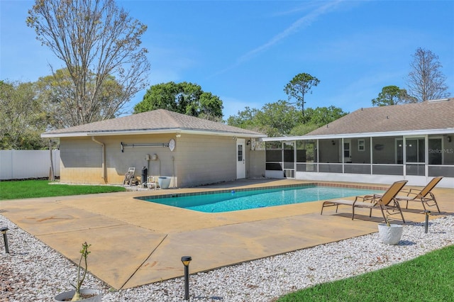 view of swimming pool featuring a fenced in pool, fence, a patio, and a sunroom