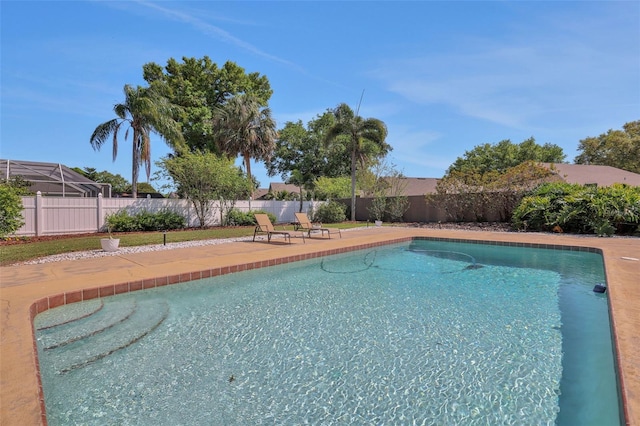 view of pool with a patio area, a fenced in pool, and a fenced backyard