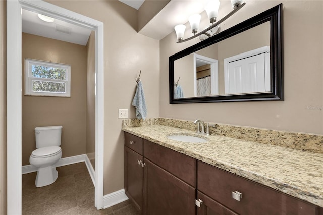 full bathroom with visible vents, baseboards, toilet, tile patterned floors, and vanity